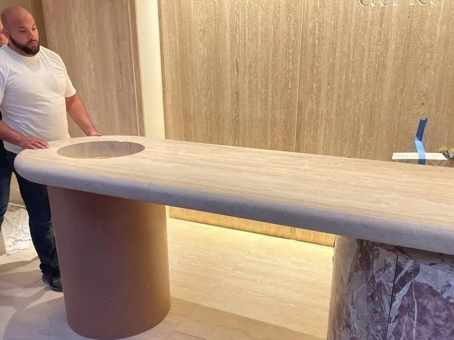 Stone vanity counter being installed